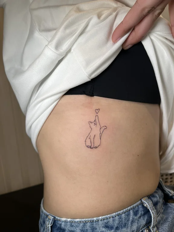 animal fine line woman linework minimal bold line soft shading elegant tattoo Canggu Bali