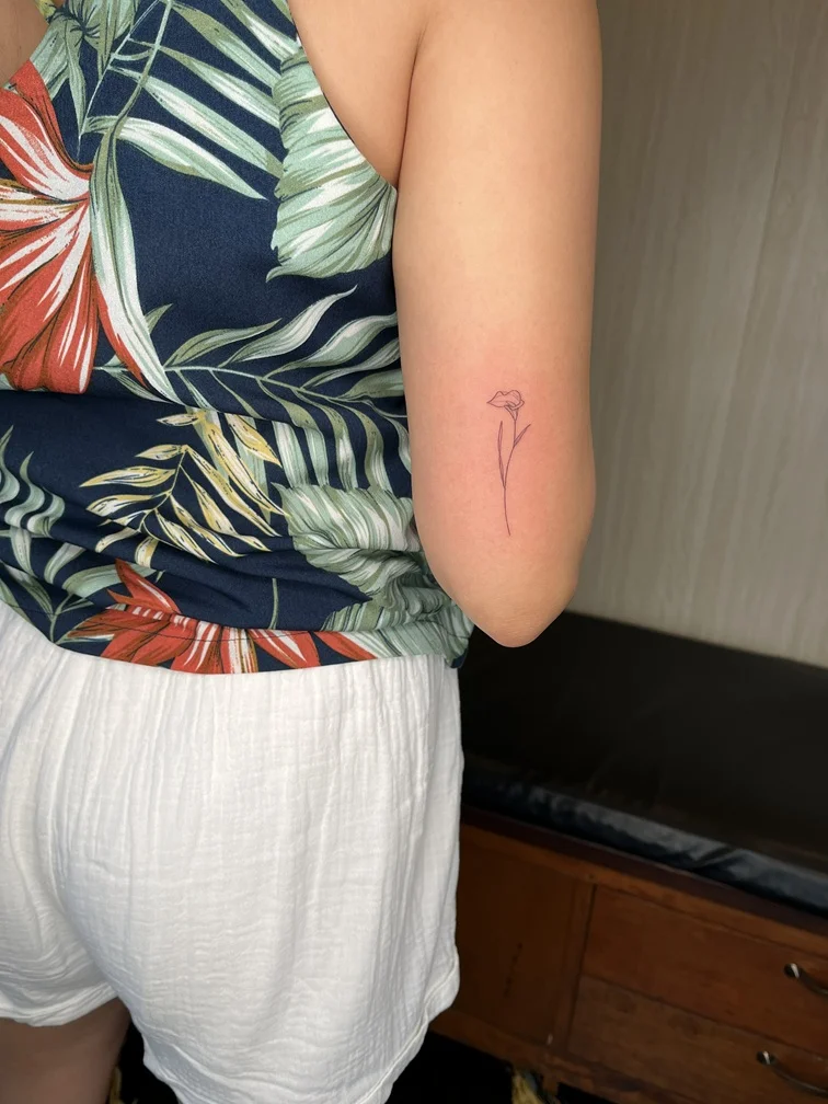 fineline fine line flower woman hand tattoo black linework tattoo canggu bali