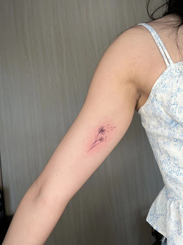 fineline linework line flower woman hand tattoo black red elegant tattoo canggu bali