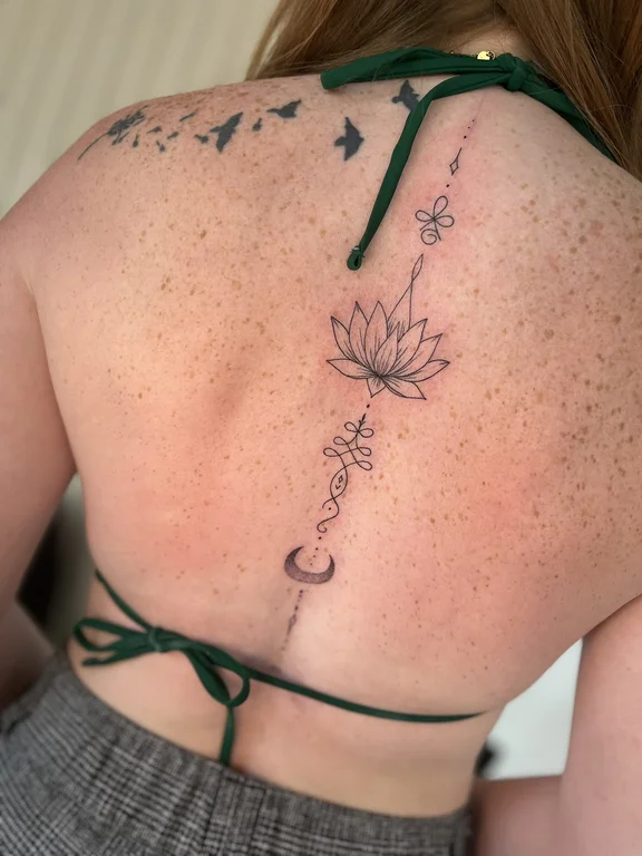 floral fine line lotus linework elegant spiritual dotwork soft shading tattoo Canggu Bali