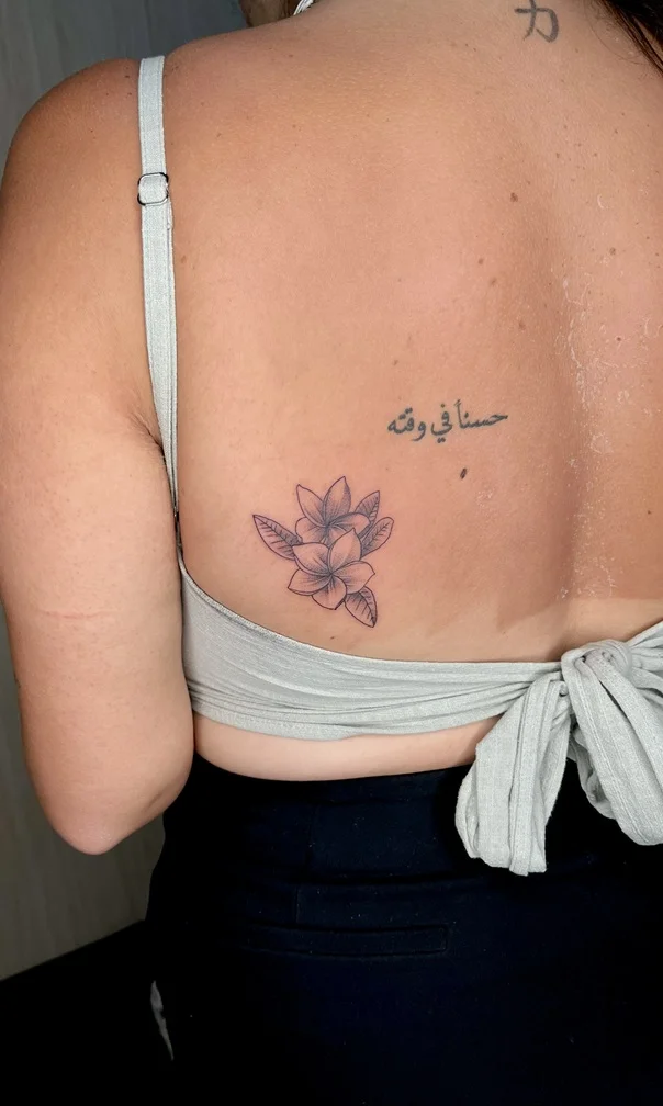 woman back flower fine line fineline linework line shading black tattoo canggu bali