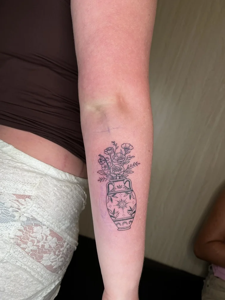 woman flower vas hand fineline linework line tattoo tattoo canggu bali