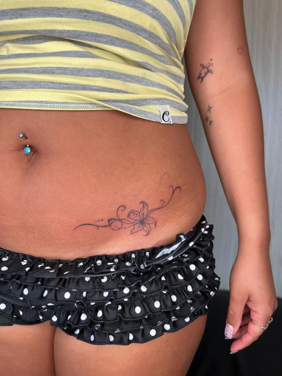 woman waist floral flower fine line line work line black tattoo canggu bali