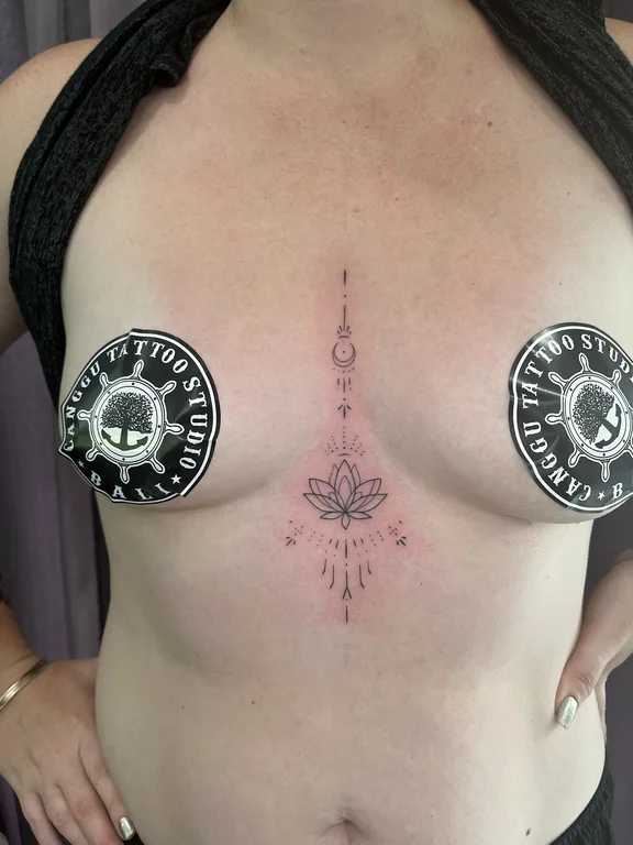 religious blackwork deity dotwork spiritual linework sun fine line tattoo Canggu Bali