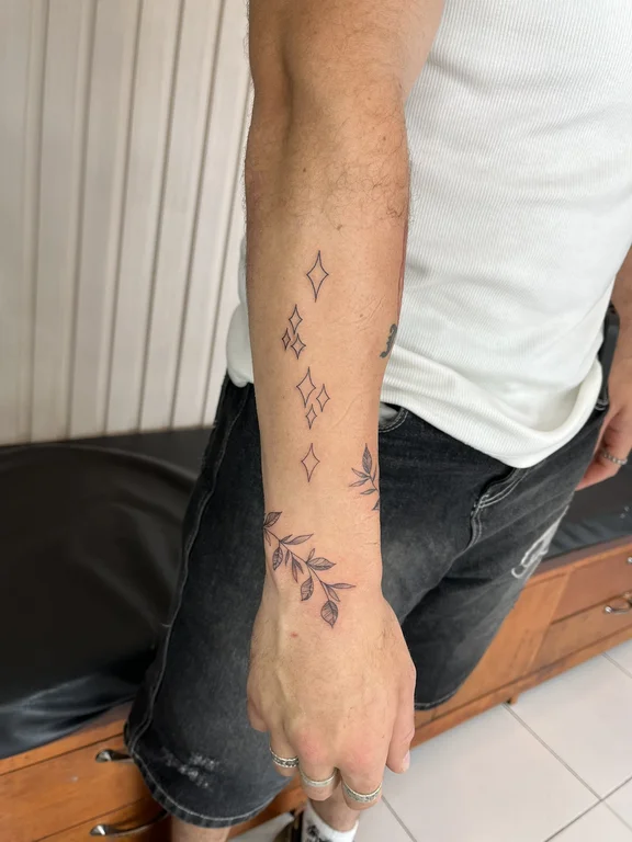 geometric fine line man dotwork minimal elegant linework soft shading tattoo Canggu Bali