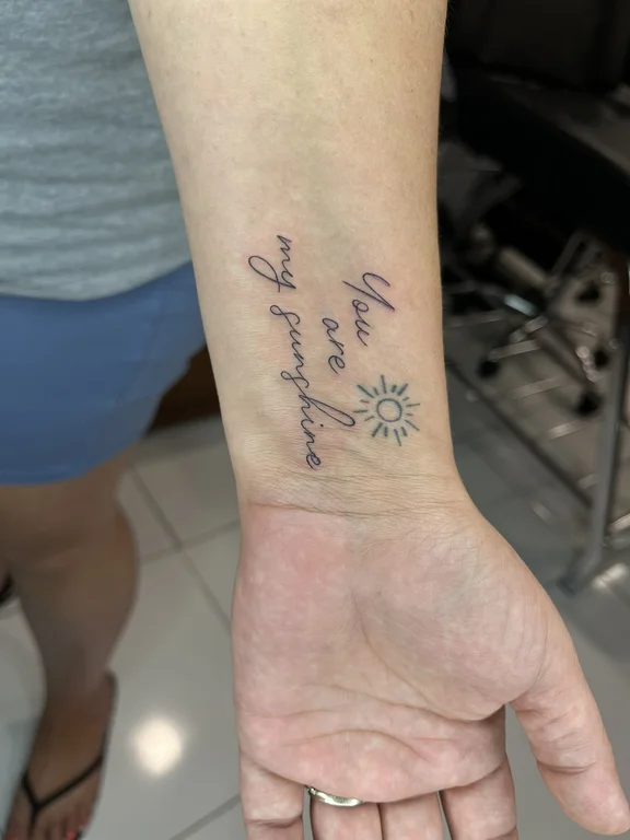 lettering fine line hand soft shading sun spiritual elegant bold line tattoo Canggu Bali