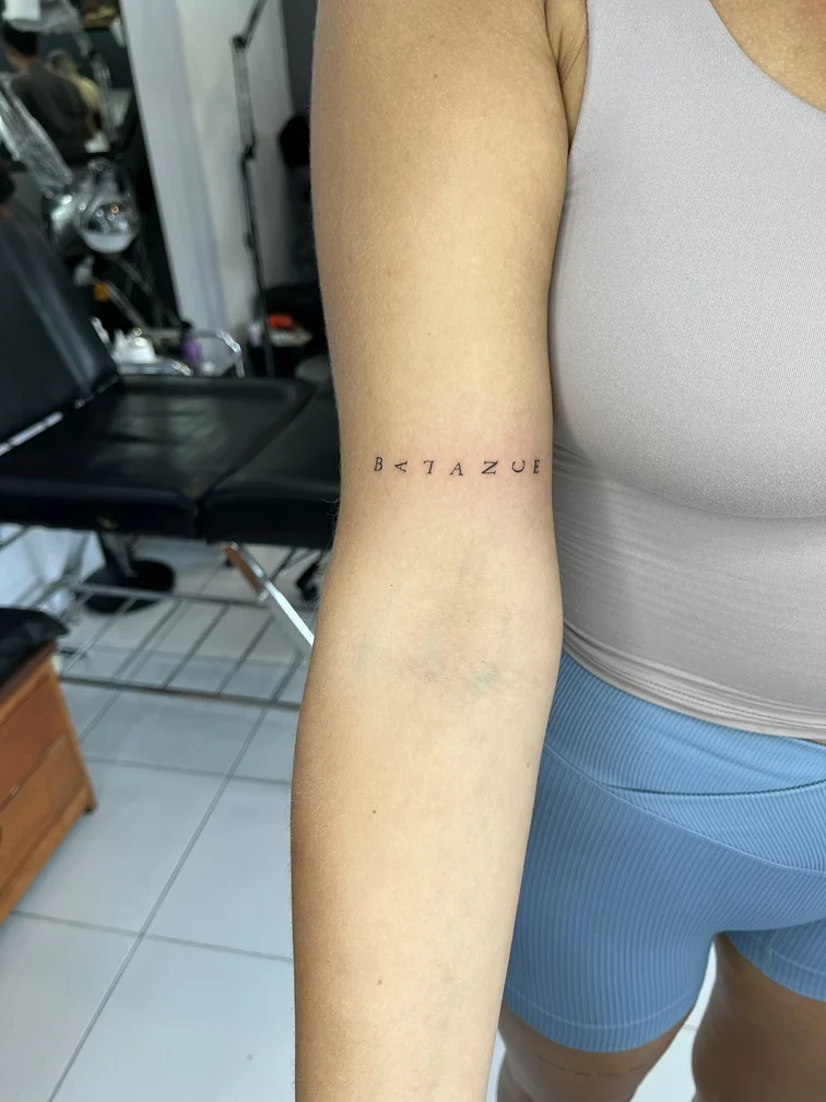 woman hand lettering fine line line work line tattoo canggu bali