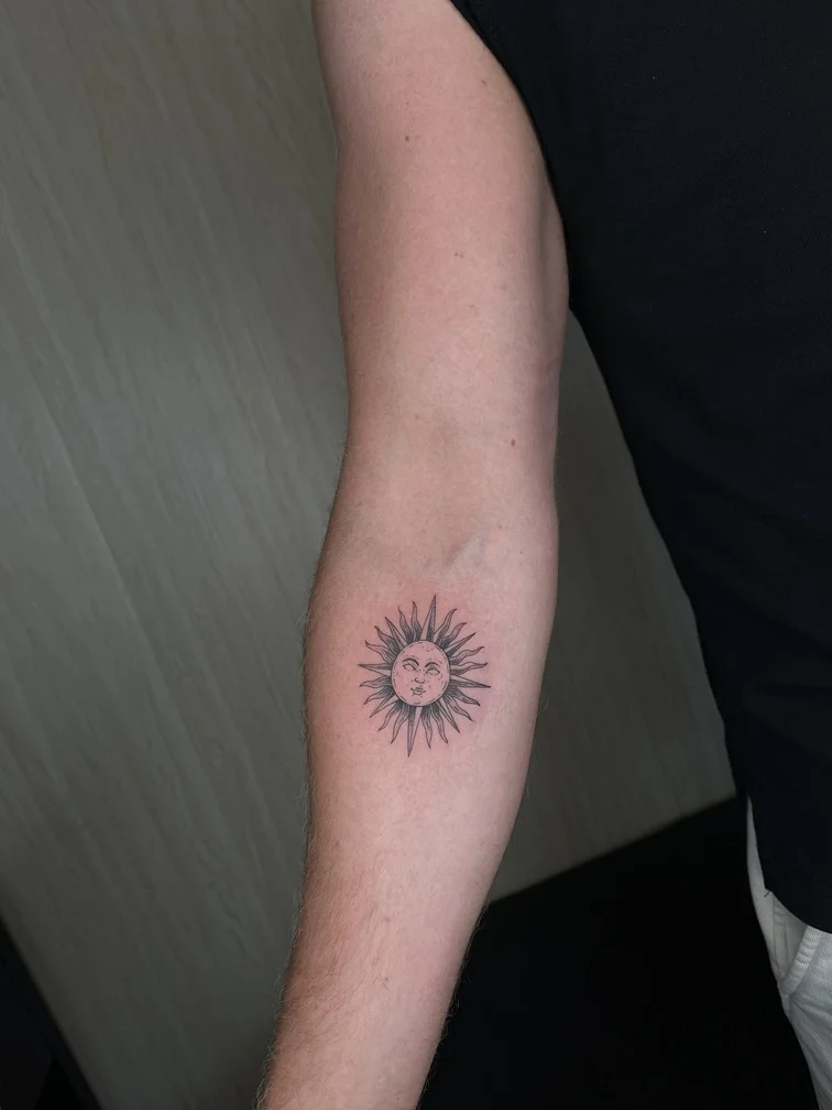 man hand sun mythology black grey shading fine line fineline linework line tattoo canggu bali