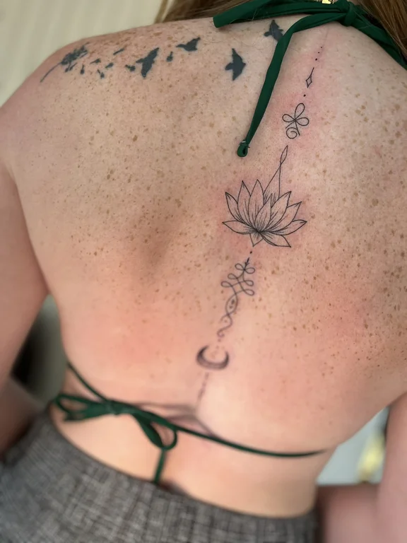 nature fine line lotus dotwork elegant spiritual linework minimal tattoo Canggu Bali