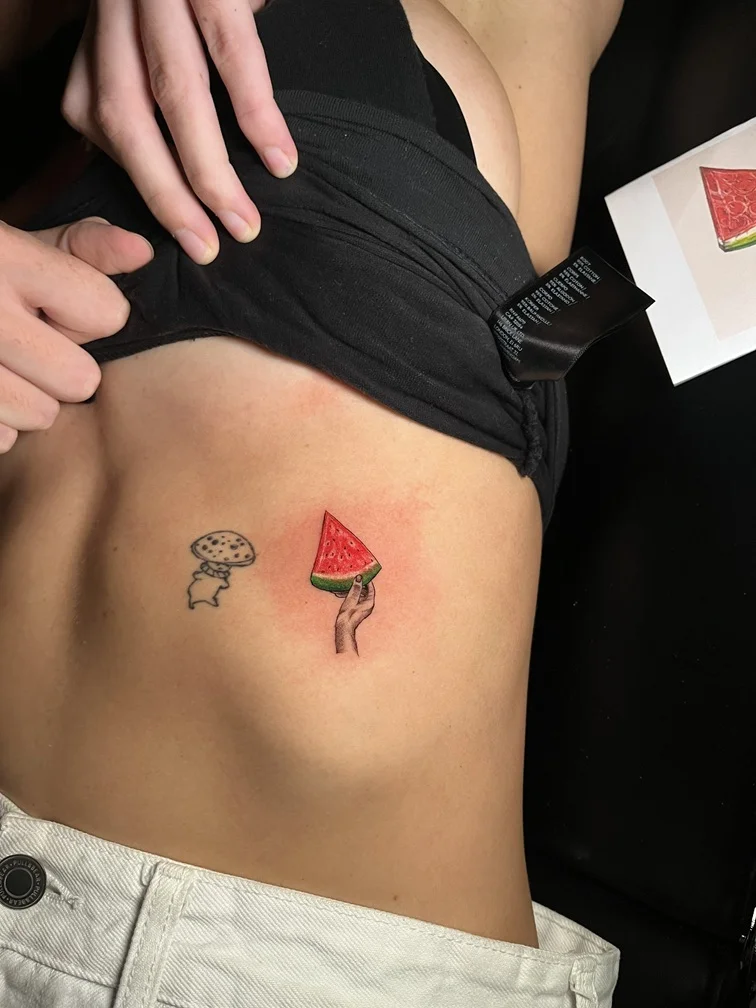 watermelon line linework color fineline woman waist hand tattoo tattoo canggu bali
