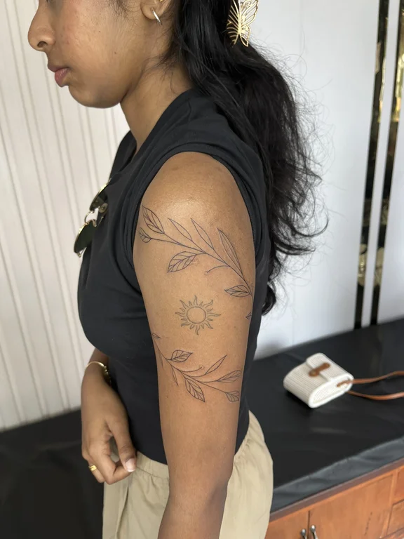 nature blackwork woman linework elegant sun fine line spiritual tattoo Canggu Bali