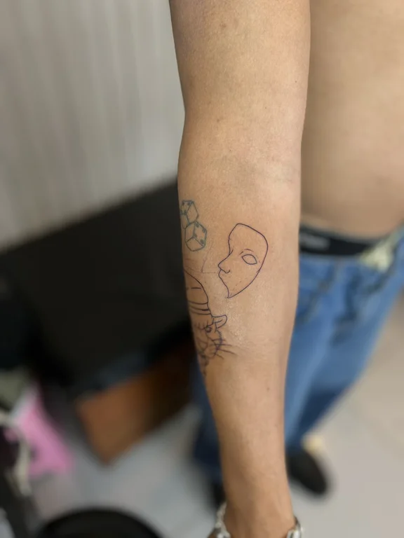 portrait fine line face linework minimal soft shading cloud dotwork tattoo Canggu Bali