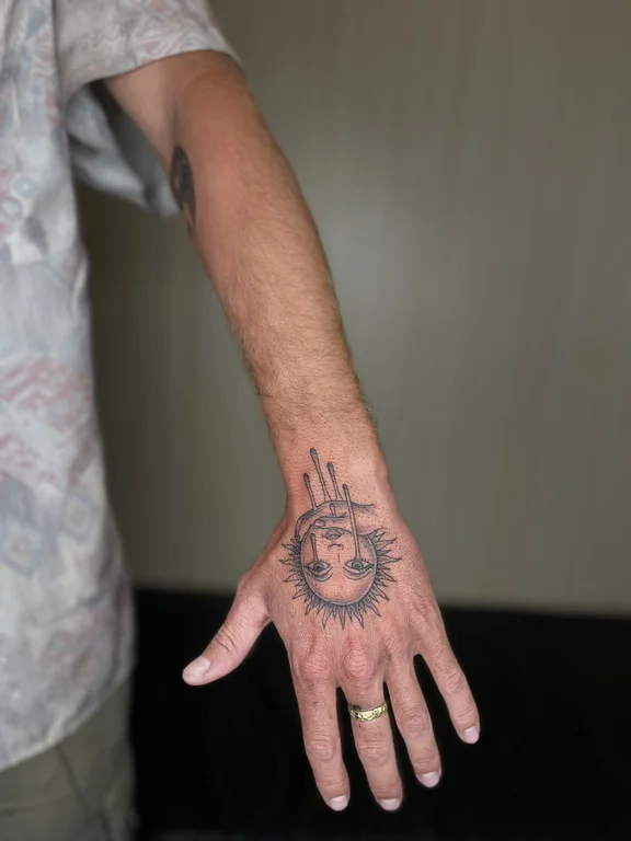 symbol fine line hand dotwork sun moon man linework tattoo Canggu Bali