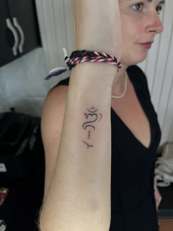 abstract minimalist snake fine line wave bold line woman linework tattoo Canggu Bali