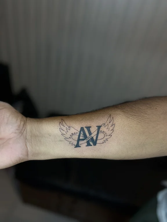 symbol fine line angel black grey cloud soft shading hand man tattoo Canggu Bali