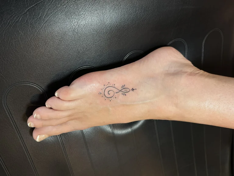 symbol fine line hand linework elegant soft shading dotwork spiritual tattoo Canggu Bali