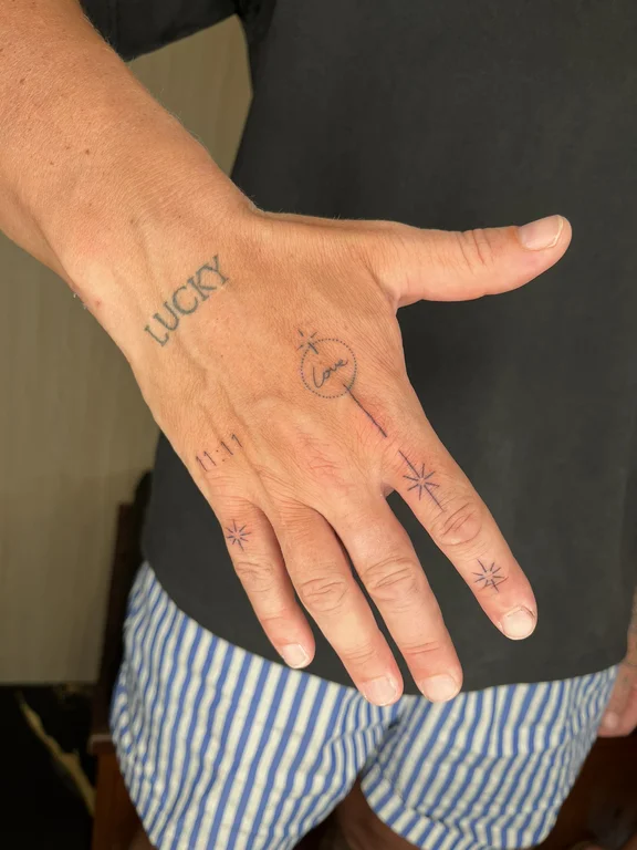 symbol fine line hand thin line wave bold line minimal linework tattoo Canggu Bali