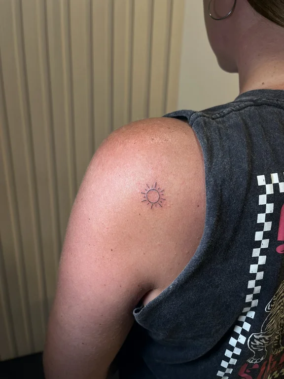 symbol fine line lotus dotwork sun minimal thin line bold line tattoo Canggu Bali