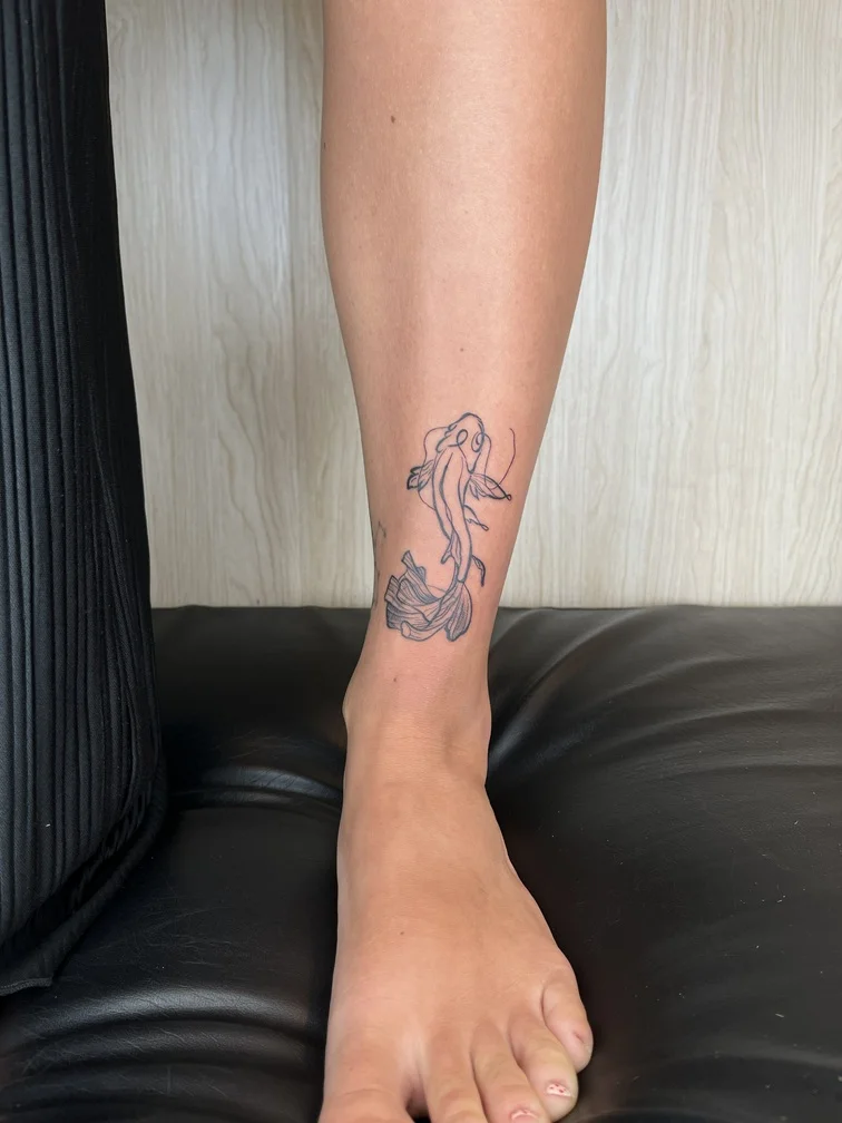 man foot fish koi japanese animal tattoo linework fineline line black tattoo canggu bali