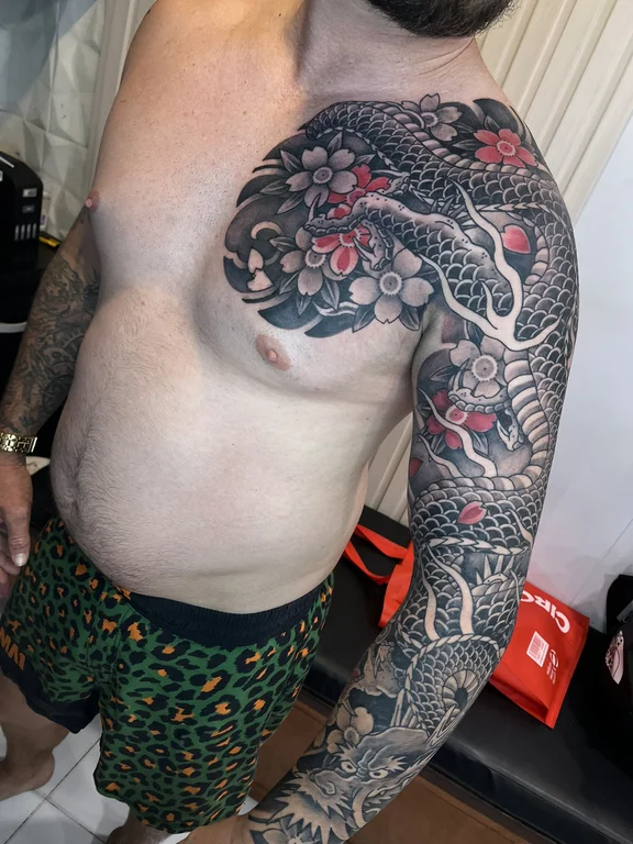 ornamental japanese koi balinese pattern cloud snake dragon heavy shading tattoo Canggu Bali