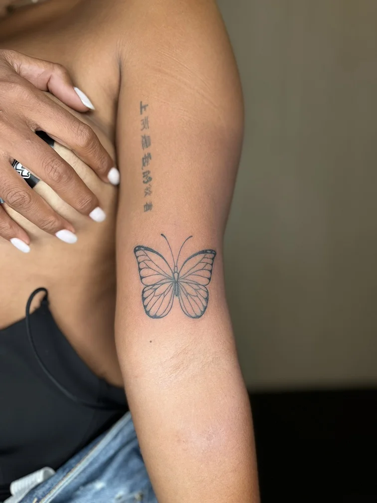 butterfly fineline linework line black grey shading woman hand tattoo animal tattoo canggu bali