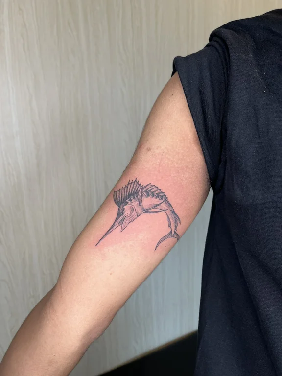 linework minimal bold line elegant fish animal sea man hand tattoo canggu bali