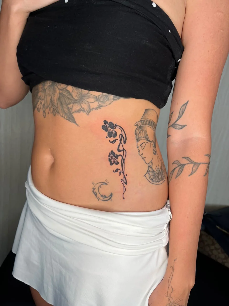 woman front flower black line work fine line line floral tattoo canggu bali