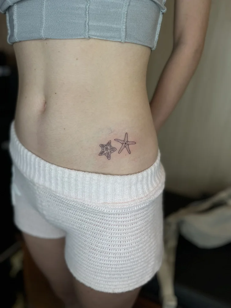 starfish tattoo woman waist sea blackwork animal black line shading tattoo canggu bali