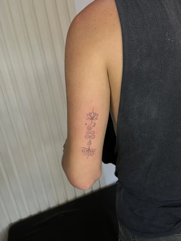 abstract minimalist lotus dotwork minimal elegant linework fine line tattoo Canggu Bali