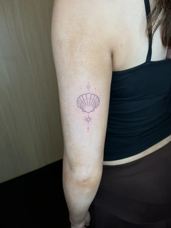 abstract minimalist lotus fine line elegant minimal dotwork soft shading tattoo Canggu Bali