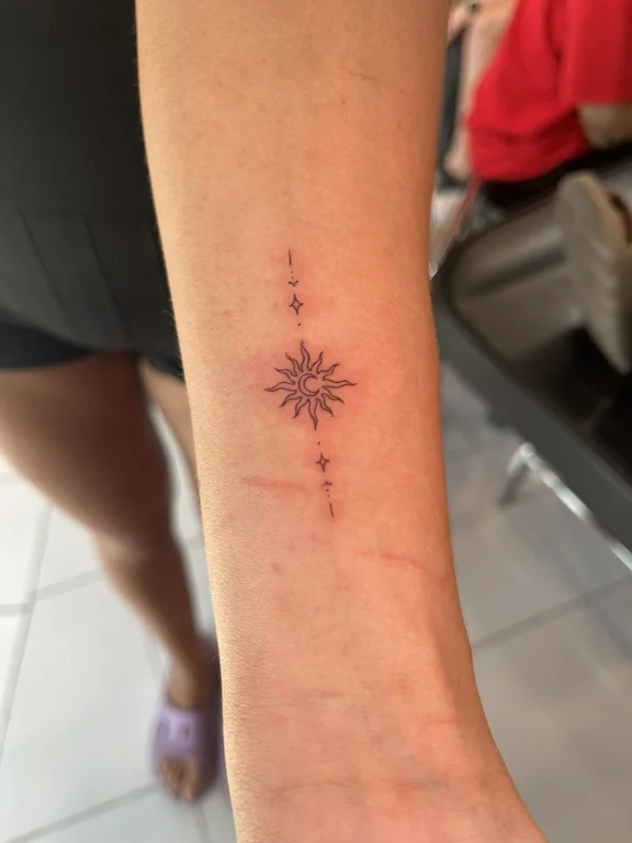 abstract minimalist lotus fine line sun dotwork soft shading minimal tattoo Canggu Bali