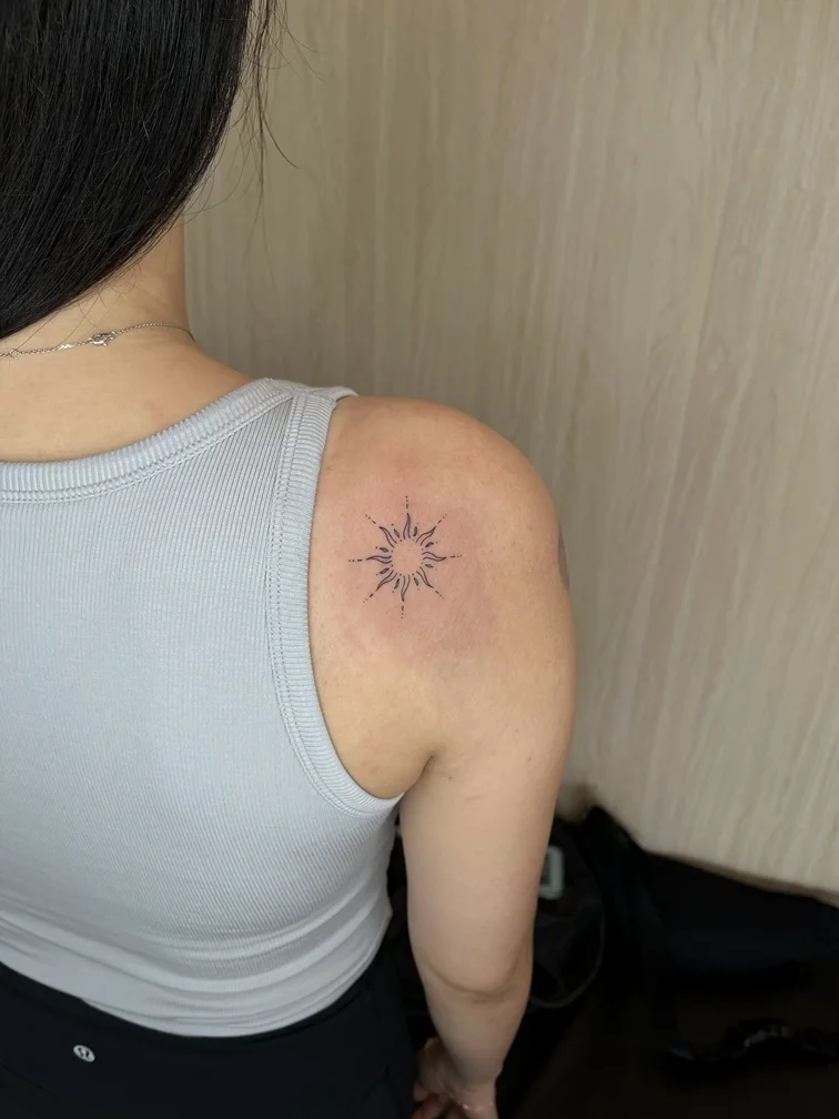 woman back abstract minimalist sun black fine line linework line tattoo canggu bali