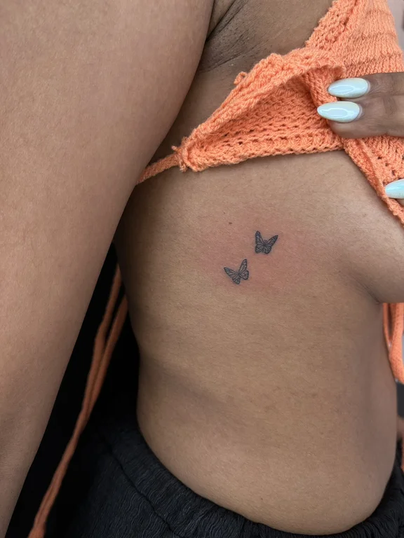 symbol minimalist butterfly soft shading minimal elegant fine line black grey tattoo Canggu Bali