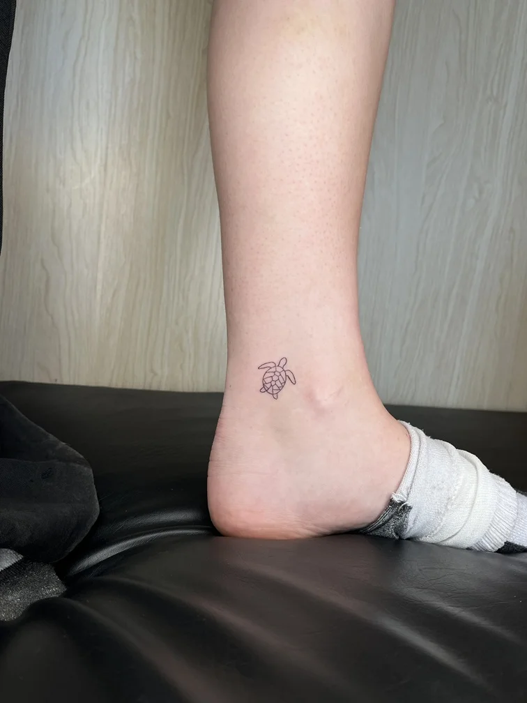 fineline linework turtle line tattoo foot black sea tattoo canggu bali