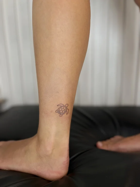 floral minimalist lotus fine line minimal dotwork elegant soft shading tattoo Canggu Bali