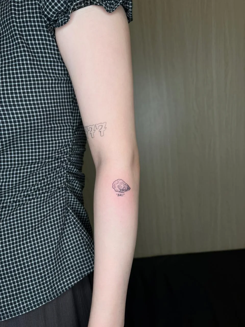 man hand shell small minimalist animal sea fine line line work line tattoo canggu bali