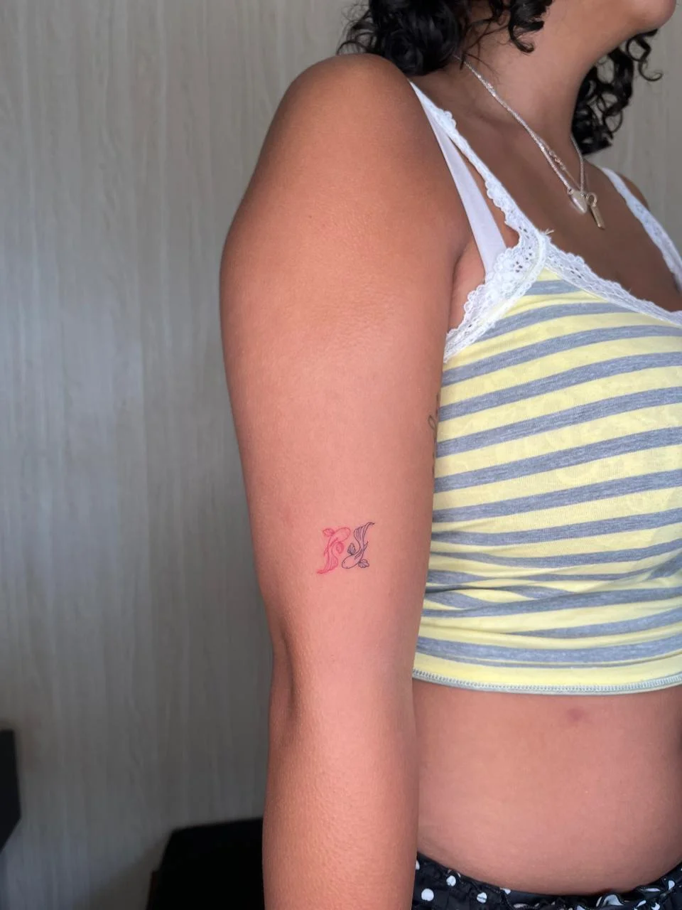 woman hand minimalist animal fish fine line line work color line tattoo canggu bali