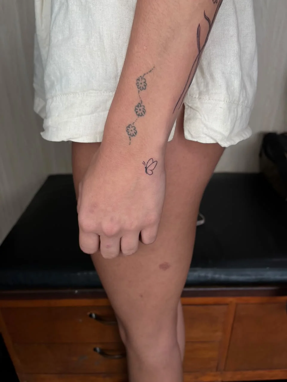 woman hand small minimalist butterfly animal fine line line work line tattoo canggu bali