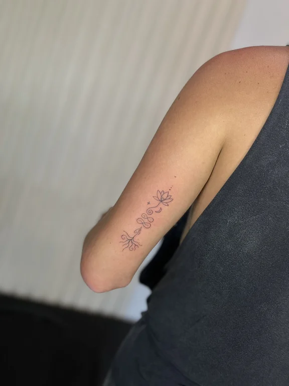 floral minimalist hand fine line minimal elegant soft shading spiritual tattoo Canggu Bali