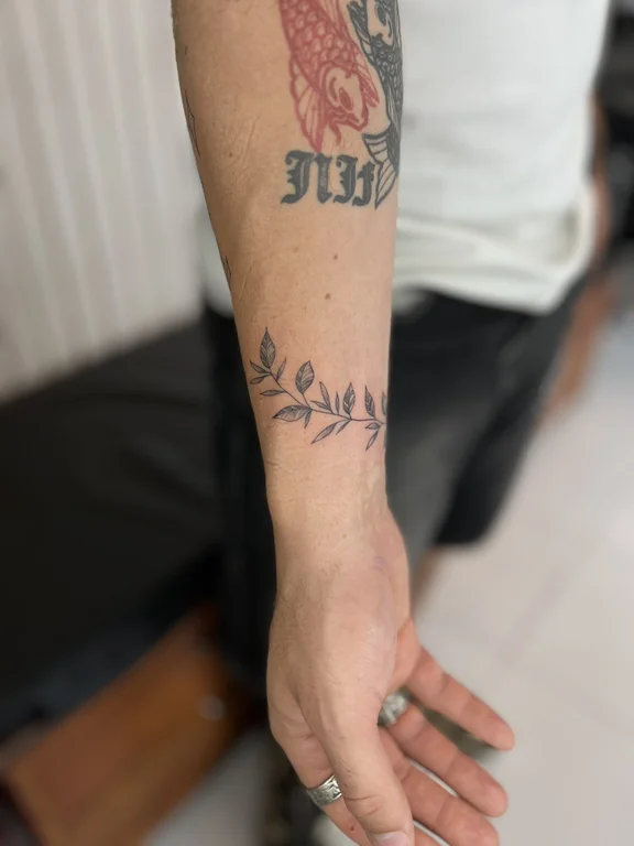 floral minimalist hand soft shading elegant minimal leaf linework tattoo Canggu Bali