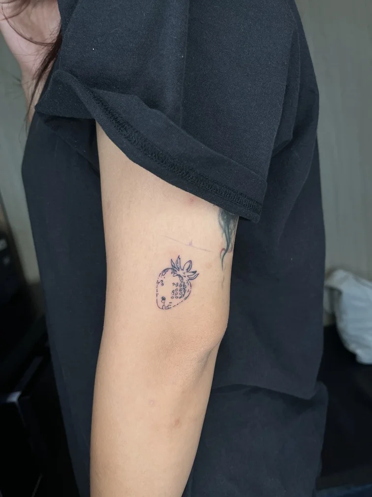 hand woman strawberry black fineline fine line linework line tattoo small minimalist tattoo canggu bali