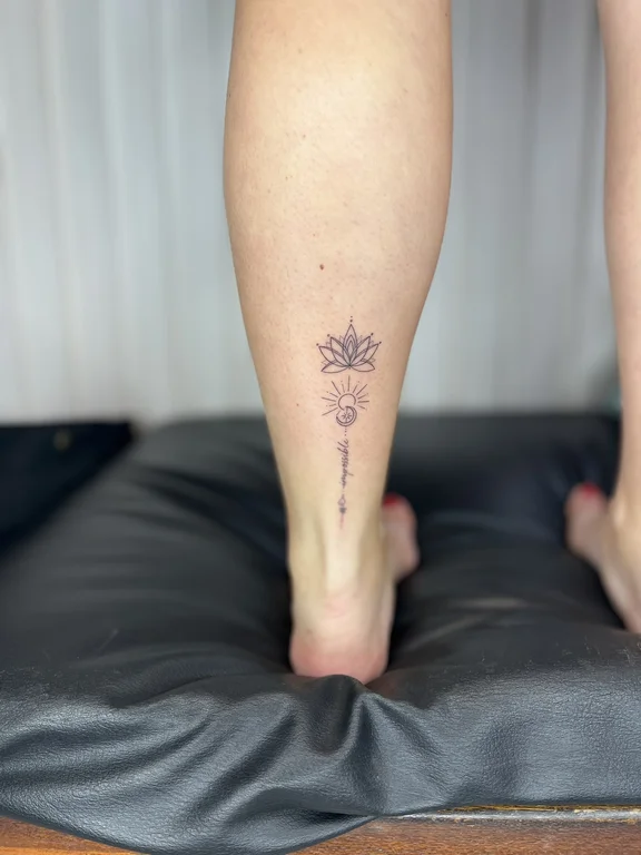 floral minimalist lotus fine line sun dotwork soft shading minimal tattoo Canggu Bali