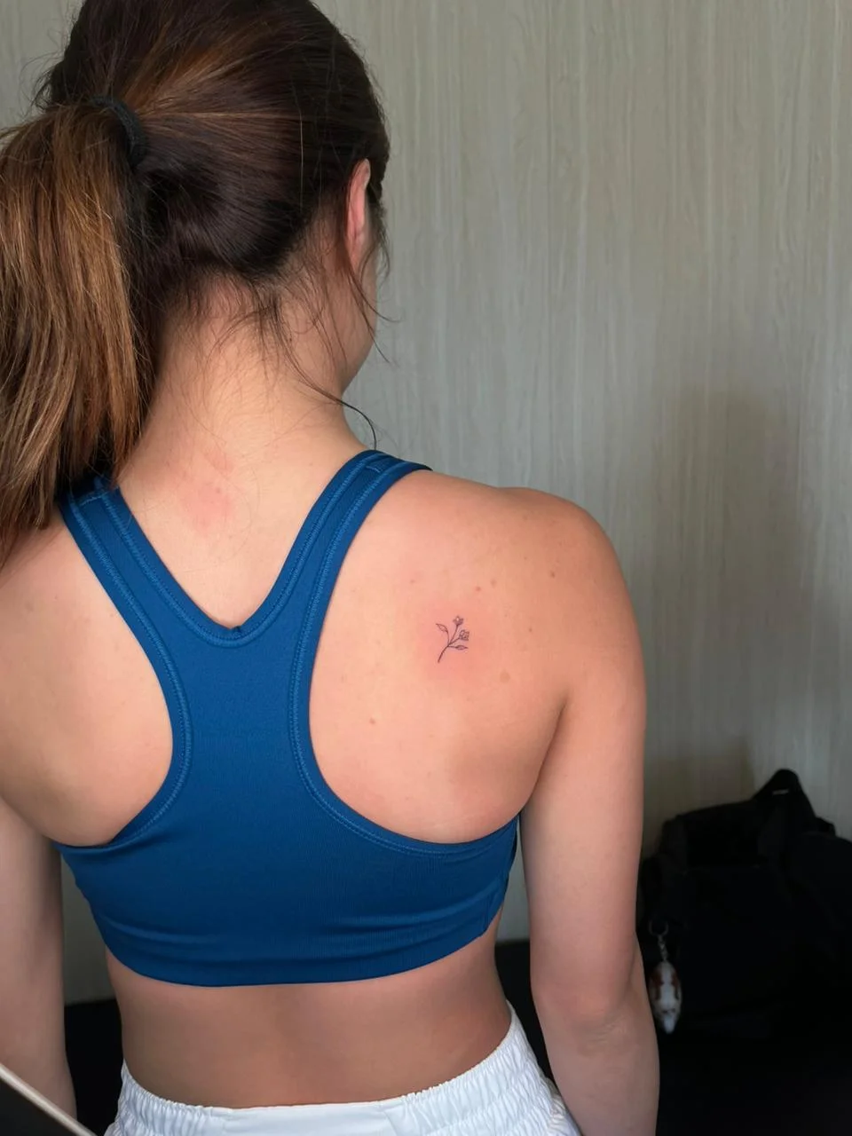 woman back flower minimalist small fine line line work line tattoo canggu bali