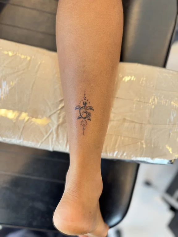religious fine line deity dotwork spiritual sun linework elegant tattoo Canggu Bali
