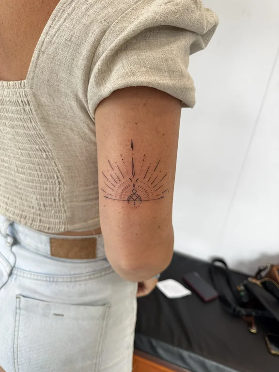 geometric minimalist deity dotwork sun spiritual minimal fine line tattoo Canggu Bali