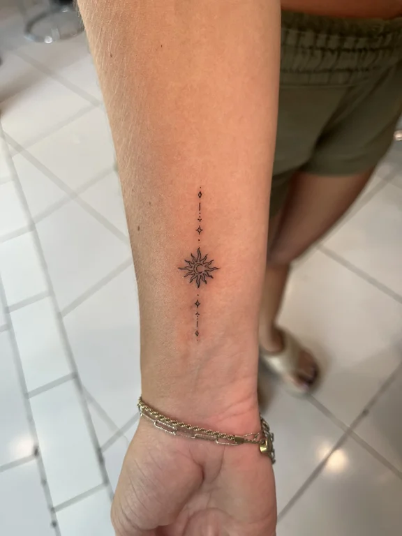 geometric minimalist deity fine line sun dotwork minimal thin line tattoo Canggu Bali