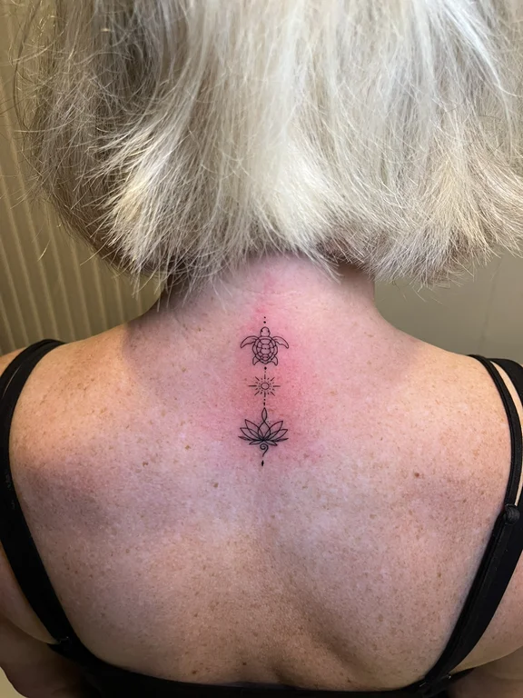 symbol fine line lotus dotwork spiritual linework elegant soft shading tattoo Canggu Bali
