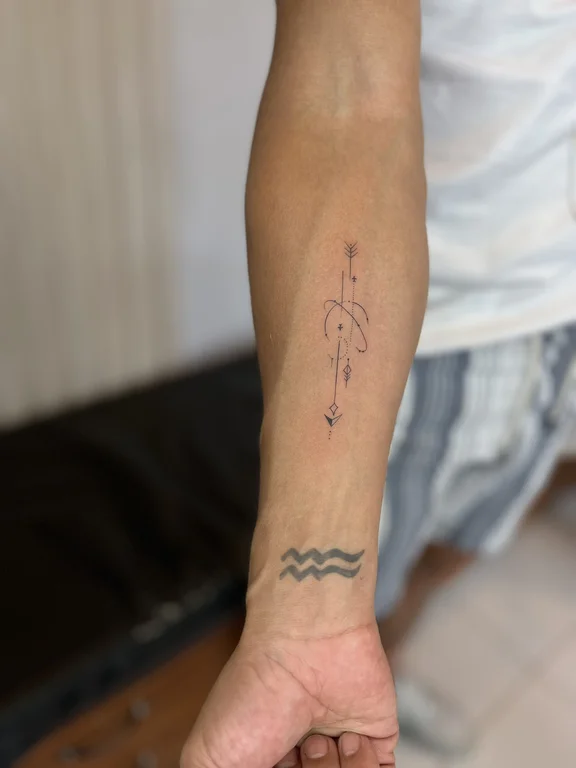 religious minimalist man fine line wave spiritual minimal bold line tattoo Canggu Bali