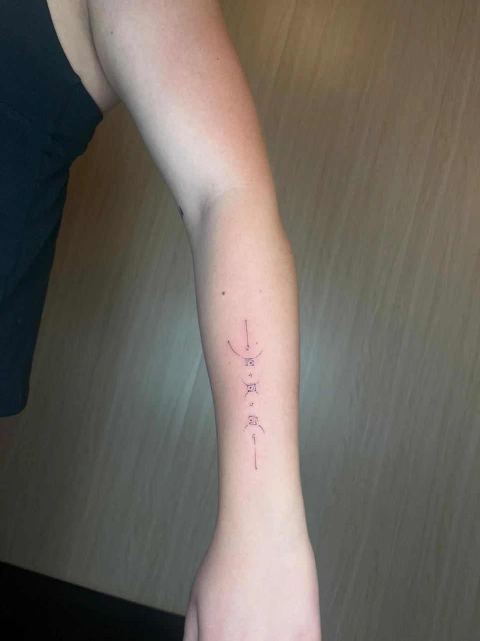 man hand small minimalist geometric fine line line work line tattoo canggu bali