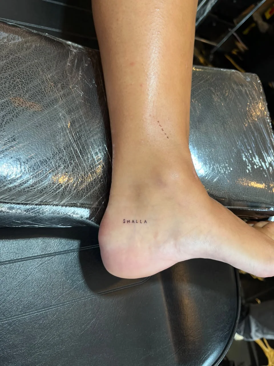 leg foot small lettering minimalist fine line line work line tattoo canggu bali